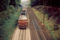DSB MZ 1417 (type II) photographed in Fredericia - heading for Kolding.September 1975.  The MZ class (type I and II) was purchased from 1967 to 1970 in a number of 26. Only a few of these engines remain in service by DSB - most are now sold to other companies. MZ 1417 was in 2001 sold to Railion. Built by NOHAB and Frichs. Dieselelectric. Co'Co'. 2270 kW - 3300 hp. Max speed 143 km/h - 89 mph. Length 20 800 mm. Weight 116,5 metric tonnes.